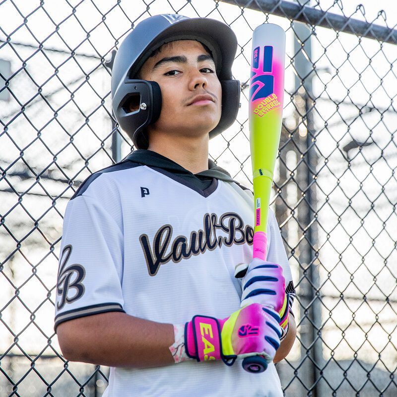 A player with a bat wearing Walk-Off Ethos Dub batting gloves