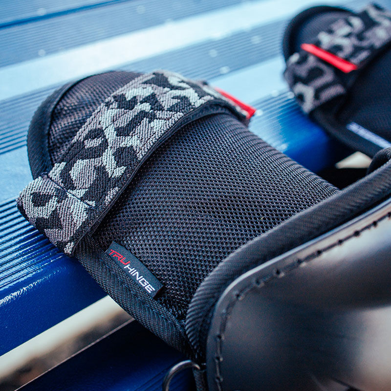 TruHinge thigh pad on a Hellcat Mojo fielding leg guard - SKU: HELMOLG loading=