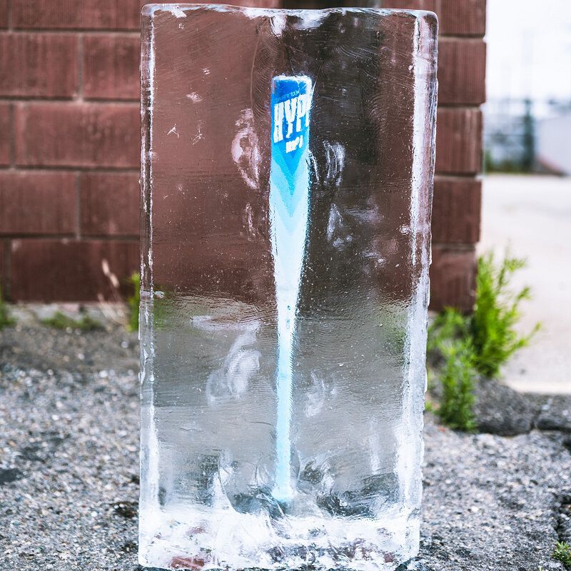 Picture of an Easton Hype Fire Arctic Flame USSSA bat frozen in a block of ice