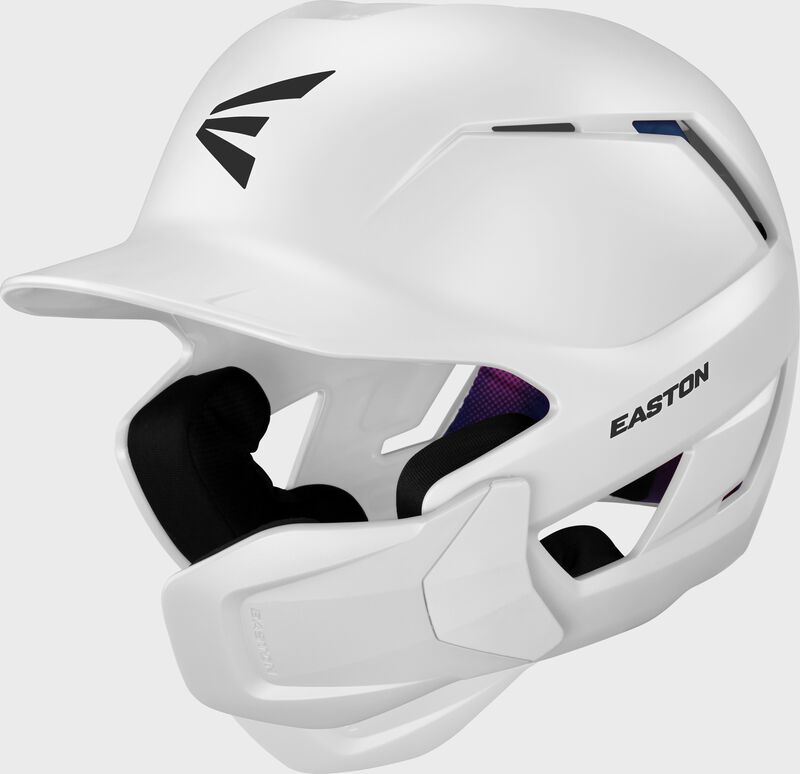 Front left of a white Easton Z50 batting helmet with mult-adjust jaw guard showing the jaw guard adjustability loading=