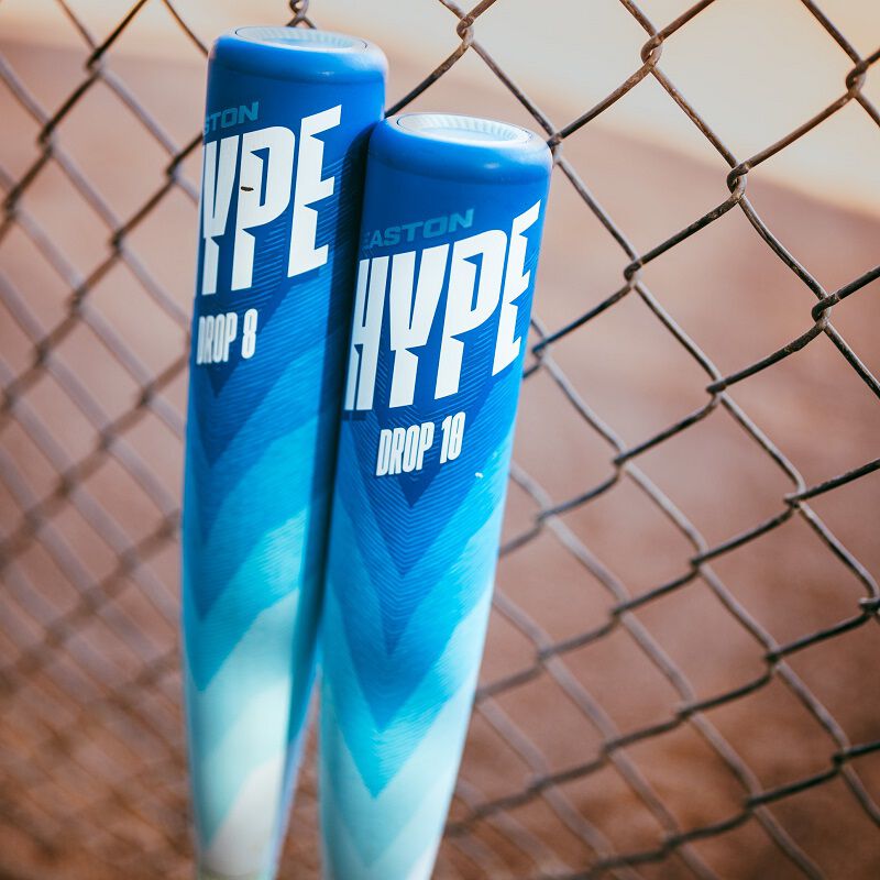A picture of two Hype Fire Arctic Flame bats standing up against a fence