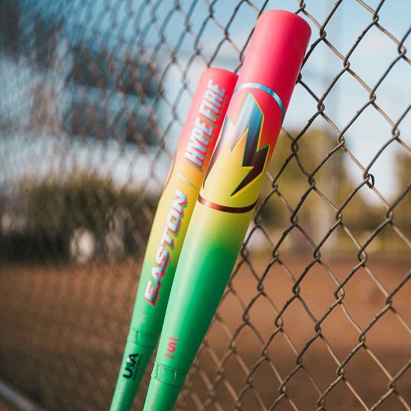 Picture of the barrel of two 2026 Easton Hype Fire USA Baseball bats leaning against a fence
