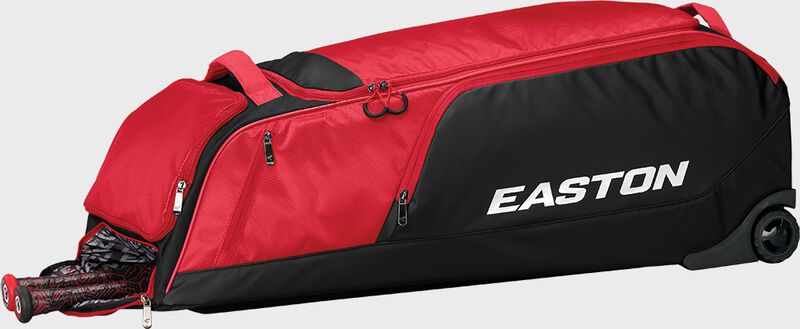 A red dugout wheeled bag laying down