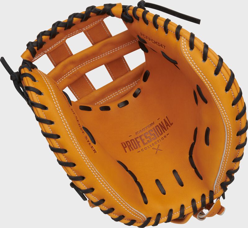 Tan palm of an Easton Professional Collection Color Splash fastpitch catcher’s mitt with black laces