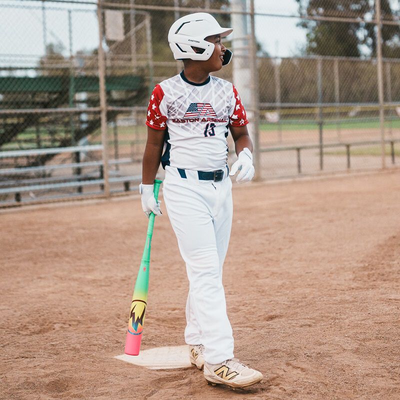 Picture of a player walking with a 2026 Easton Hype Fire USA Baseball bat