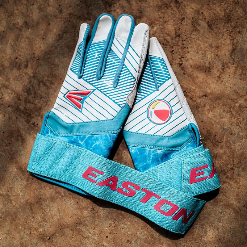 A pair of Easton Walk-Off Ethos Locked-In Pool Party batting gloves on dirt loading=