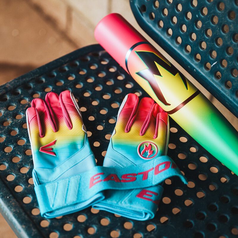 A pair of Eason Walk-Off Ethos Locked-In Fire batting gloves on a bench with a Hype Fire bat loading=