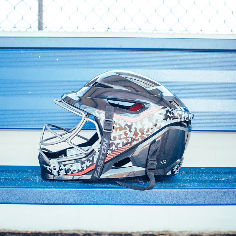 Left side of a black Hellcat Mojo fielding helmet on a bench in the dugout - SKU: HELMOSPH loading=