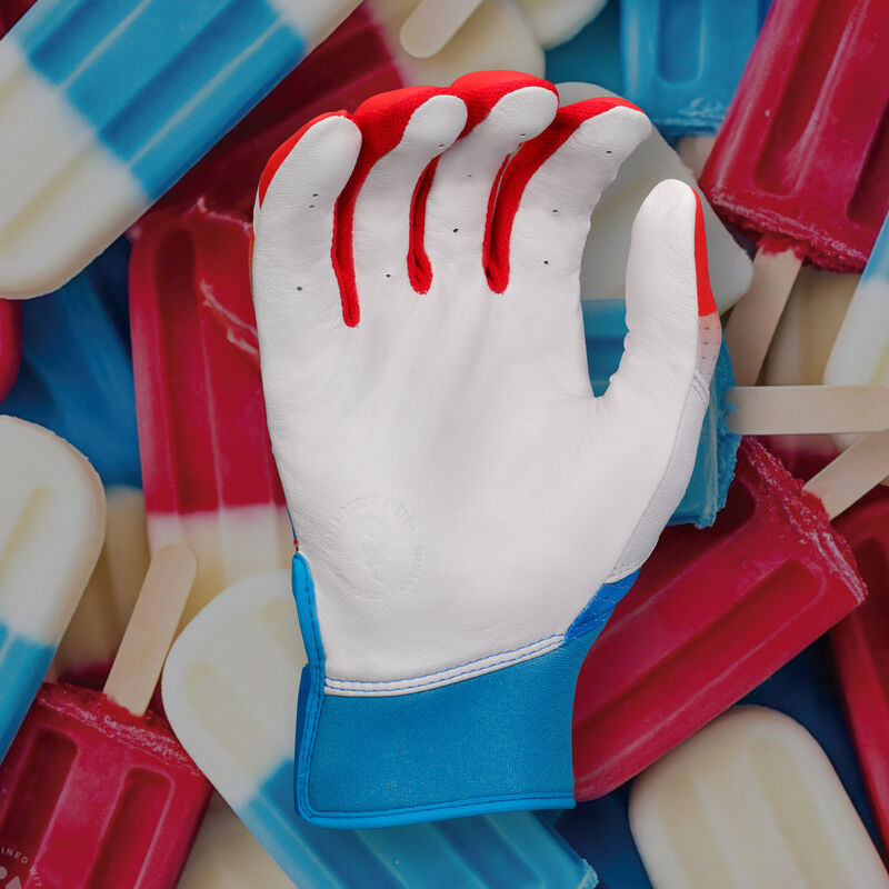 White palm of a red/white/blue Easton Rocket Pop Ghost Ethos fastpitch batting glove with a Rocket Pop theme background