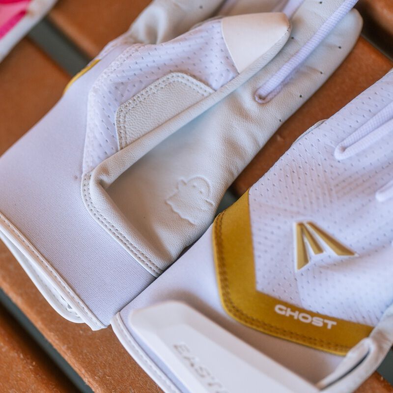 Picture of the back and palm of a pair of white Ghost Ethos Snowstorm fastpitch batting gloves loading=