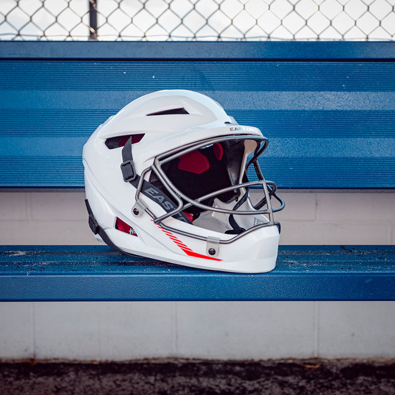 A white Hellcat slowpitch fielding helmet on a dugout bench - SKU: EHCATH loading=