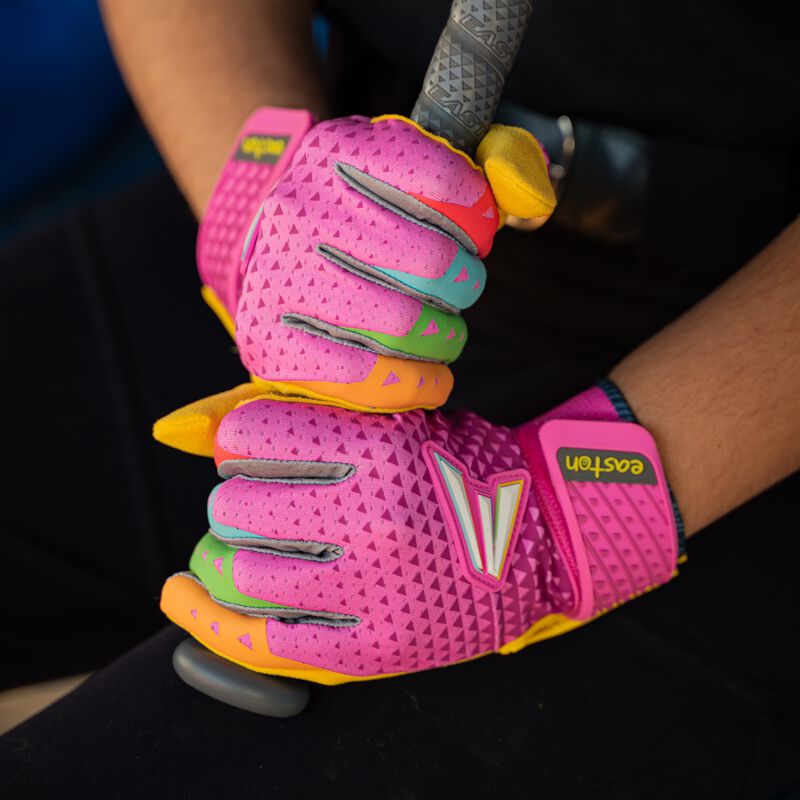 Picture of two hands wearing pink Easton x Happiness Project Ghost NX fastpitch batting gloves holding a bat