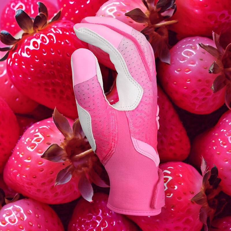 Thumb of a "Strawberry Glow" Easton Ghost Ethos fastpitch batting glove with a pink strawberry theme background