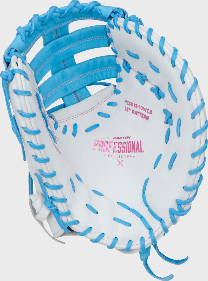 White palm of a white/Columbia blue Easton Professional Collection 13" fastpitch 1st base mitt with pink stamping and Columbia blue laces