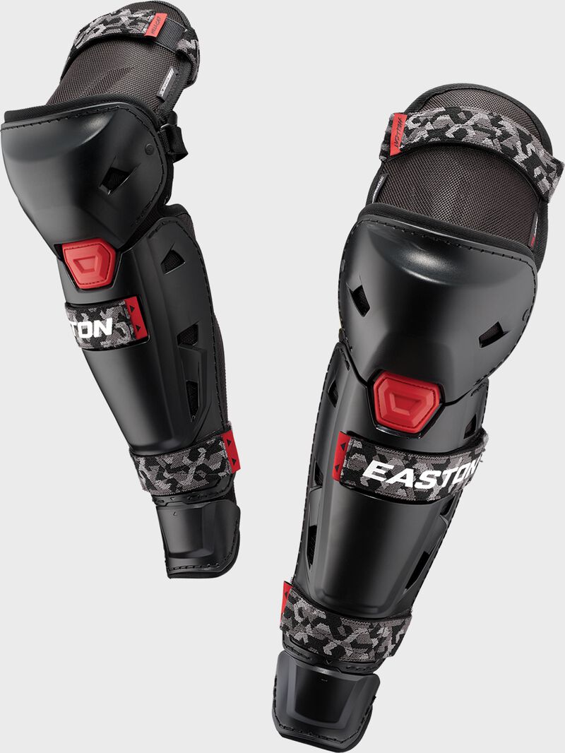A pair of black Easton Hellcat Mojo slowpitch fielding leg guards with grey camo straps - SKU: HELMOLG loading=