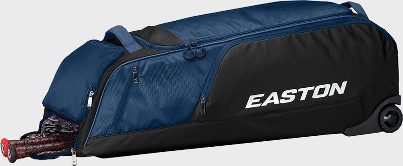 A navy dugout wheeled bag laying down