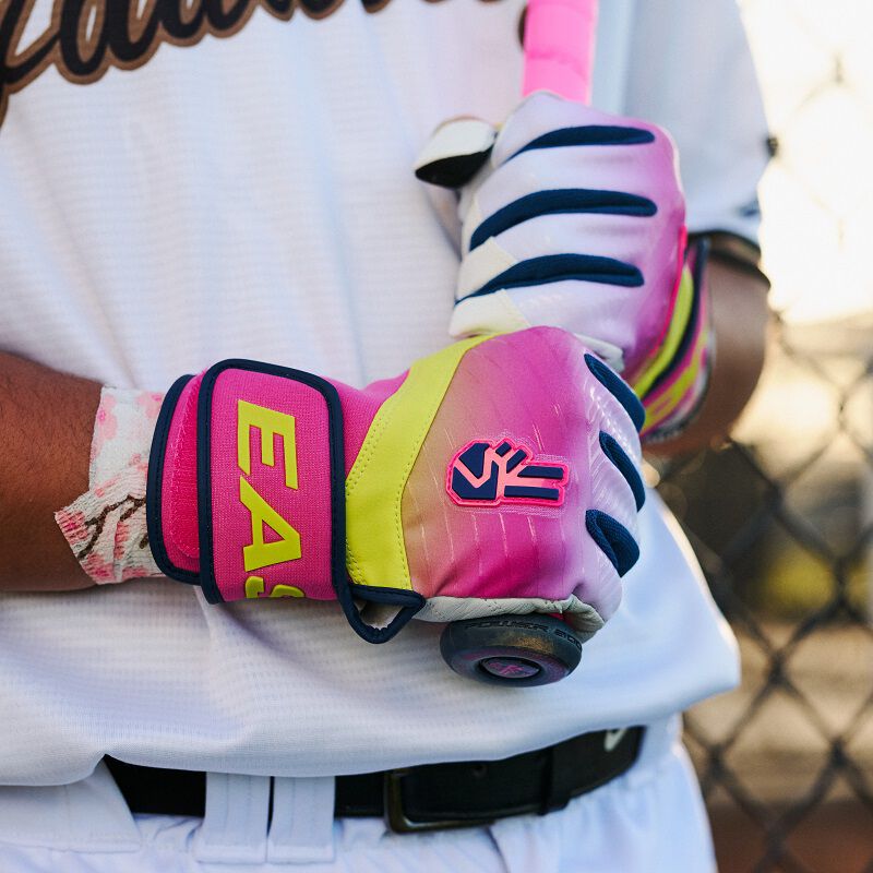 Picture of a player holding a bat wearing Walk-Off Ethos Dub batting gloves