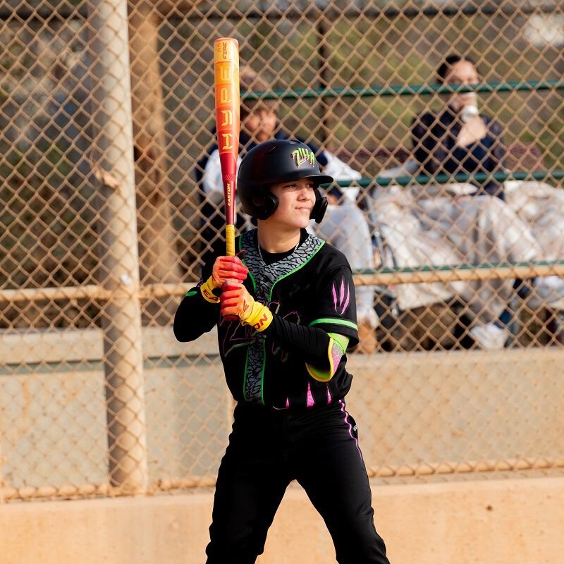 A player batting with a 2025 USSSA Hype Fire Bat
